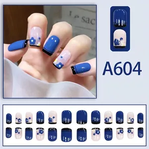 Short square press-on nails in navy blue and cream white with delicate flower patterns