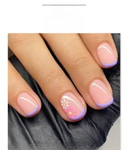 Detail of short square purple French press-on nails with daisy floral nail art patterns