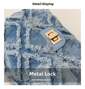 Macro view of distressed denim texture and golden buckle on the square bag details