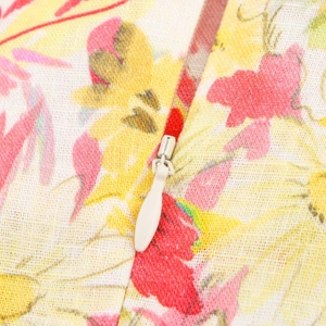Detail of floral linen blend fabric featuring a hidden cream-white zipper closure