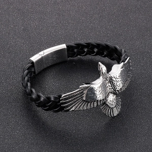 Men's punk braided leather bracelet featuring a silver stainless steel flying eagle charm