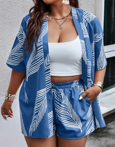 Detail of blue and white leaf print on a casual summer cardigan and shorts set