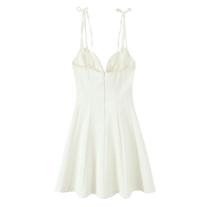 Detailed view of white poplin dress with tie-up straps and invisible back zipper
