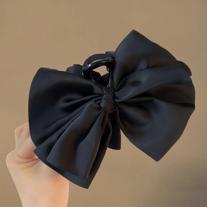 Elegant large black satin bow hair claw clip made of premium glossy fabric for women