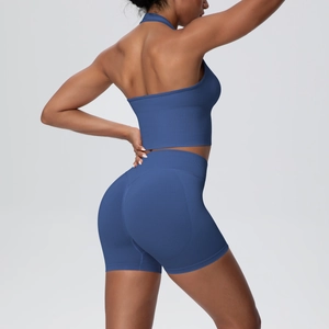 Detail of dark blue halter yoga set showing seamless ribbed fabric and back cut-out design