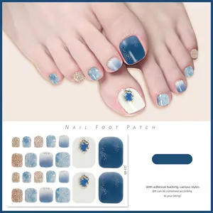 Detail view of shimmering blue and gold glitter waterproof toenail art stickers J23-06