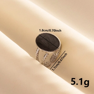 Macro detail of oval black enamel ring showing 1.8cm size and 5.1g weight specs