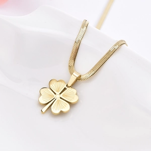 Gold stainless steel snake chain necklace featuring a clover pendant with radial texture
