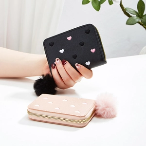 Mini plush wallets in black and pink with heart embroidery and fluffy keychains
