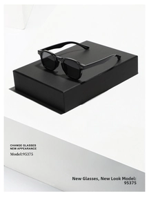 Close-up of retro black sunglasses with polished frames and metallic hinge accents