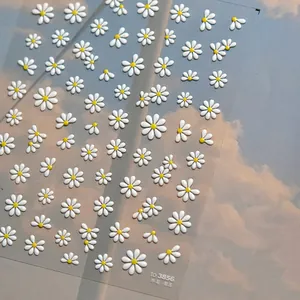 Detailed 3D relief daisy flower nail stickers with jelly texture on blue sky background
