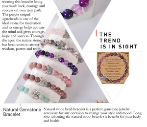 Macro details of 8mm pink zebra stone bracelet with butterfly charm and greeting card