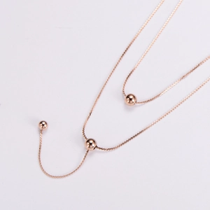 Elegant rose gold double-layered titanium steel necklace with three polished bead pendants