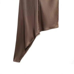 Deep brown asymmetric satin top with glossy finish and smooth draped fabric detail