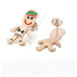 Macro detail of gingerbread man earring showing stainless steel texture and dimensions