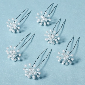 Elegant silver bridal hair pins set with white pearls for wedding hairstyling