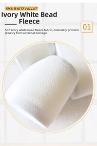 Detailed close-up of soft cream white pellet velvet lining for jewelry gift box protection