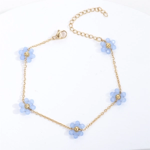 Gold chain bracelet with light blue floral beads and adjustable lobster clasp closure
