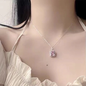 S925 sterling silver necklace with square pink gem pendant worn by a model