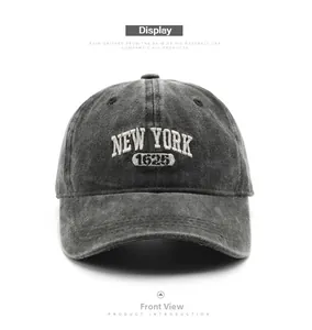 Detailed embroidery of NEW YORK 1625 on a vintage washed dark grey baseball cap