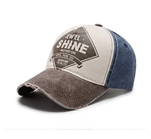 Detail of vintage washed baseball cap showing worn brim and contrast panel stitching