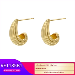 Detail showing gold brass U-shaped textured hoop earrings with dimensions and weight
