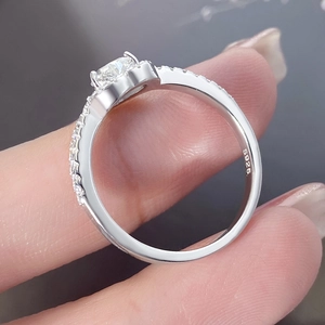 Macro detail of S925 silver ring featuring four-prong setting and hallmark engraving