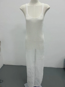 Detail view of white knit beach cover-up maxi dress featuring hollow mesh texture