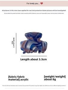 Macro view of a 3.5cm blue and purple marbled acetate hair claw clip with metal spring