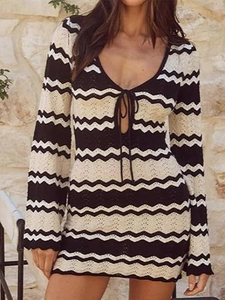 Short crochet mini dress with black and white wave pattern and lace-up V-neck detail