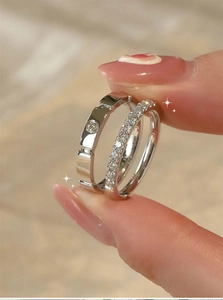 Macro detail of silver ring set with screw design and sparkling pave cubic zirconia