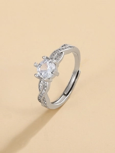 Detailed side view of silver crown ring featuring twisted band and sparkling zircon stone