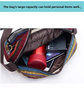 Detailed interior of ethnic striped canvas tote bag showing high capacity for tablet and water bottle