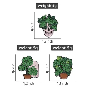 Size chart for skull and ghost monstera pins showing dimensions in inches and weight