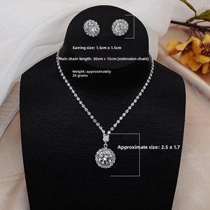 Close-up of sparkling zircon jewelry set with necklace and stud earrings on a display