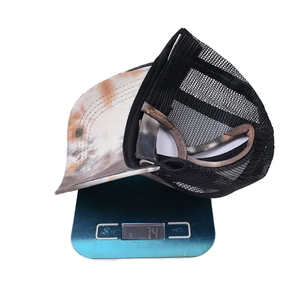 Tie-dye ponytail baseball cap with mesh back weighing 7.4g on a digital scale