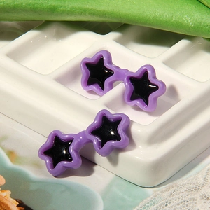 Macro view of purple star-shaped resin toy sunglasses for plush dolls and DIY crafts