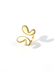 Macro shot of 18k gold plated stainless steel ring with abstract butterfly design