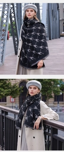 Close-up of houndstooth pattern and fringe detail on a warm winter scarf for women