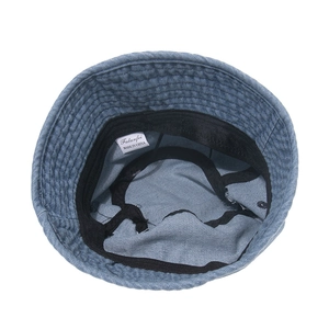 Inside view of a vintage denim bucket hat showing sweatband and high-quality stitching