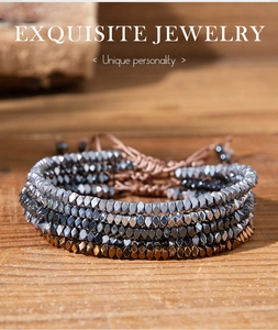 Exquisite stacked hematite bead bracelets with adjustable cord on rustic wood