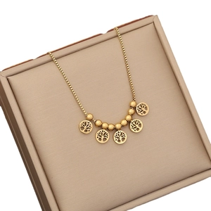 Elegant gold-plated beaded necklace featuring Tree of Life pendants on a box chain display