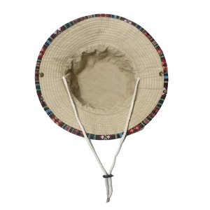 Detail of ethnic style bucket hat with geometric woven brim and adjustable chin strap