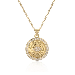 Gold pendant necklace with embossed sun-eye design and shimmering zircon crystal halo