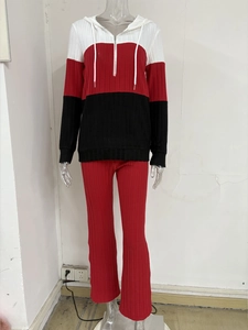 Detail view of the knit ribbed texture on the color-blocked hooded sweatsuit set