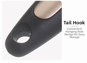Macro detail of ergonomic black handle with champagne gold trim and hanging hole