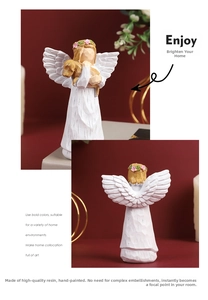 Close-up of resin angel figurine with a dog, featuring detailed wood-like textures