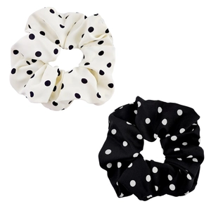 Pair of elastic polka dot scrunchies in black and white soft fabric for hair styling