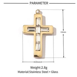Macro view of gold stainless steel cross pendant with inset glass stones and dimensions