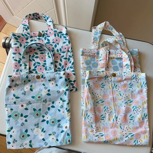 Vertical floral cotton handbags with metal snap buttons and double-layer fabric design